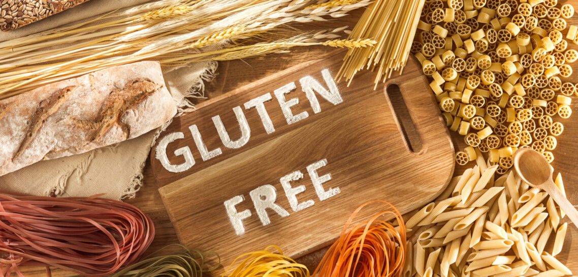 Gluten free food. Various pasta, bread and snacks on wooden background from top view What is the Gluten allergy